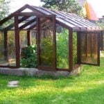 Glass Greenhouse with Their Hands