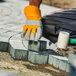 Laying Paving Stones With Their Hands