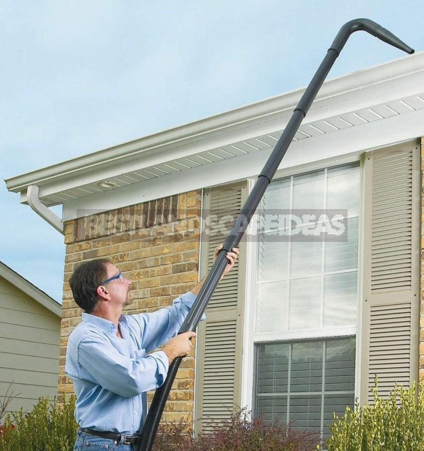 Cleaning The Drains Of a Country House From Leaves And Other Debris