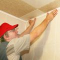 We Glue The Ceiling Tile Made Of Expanded Polystyrene In The Bathroom